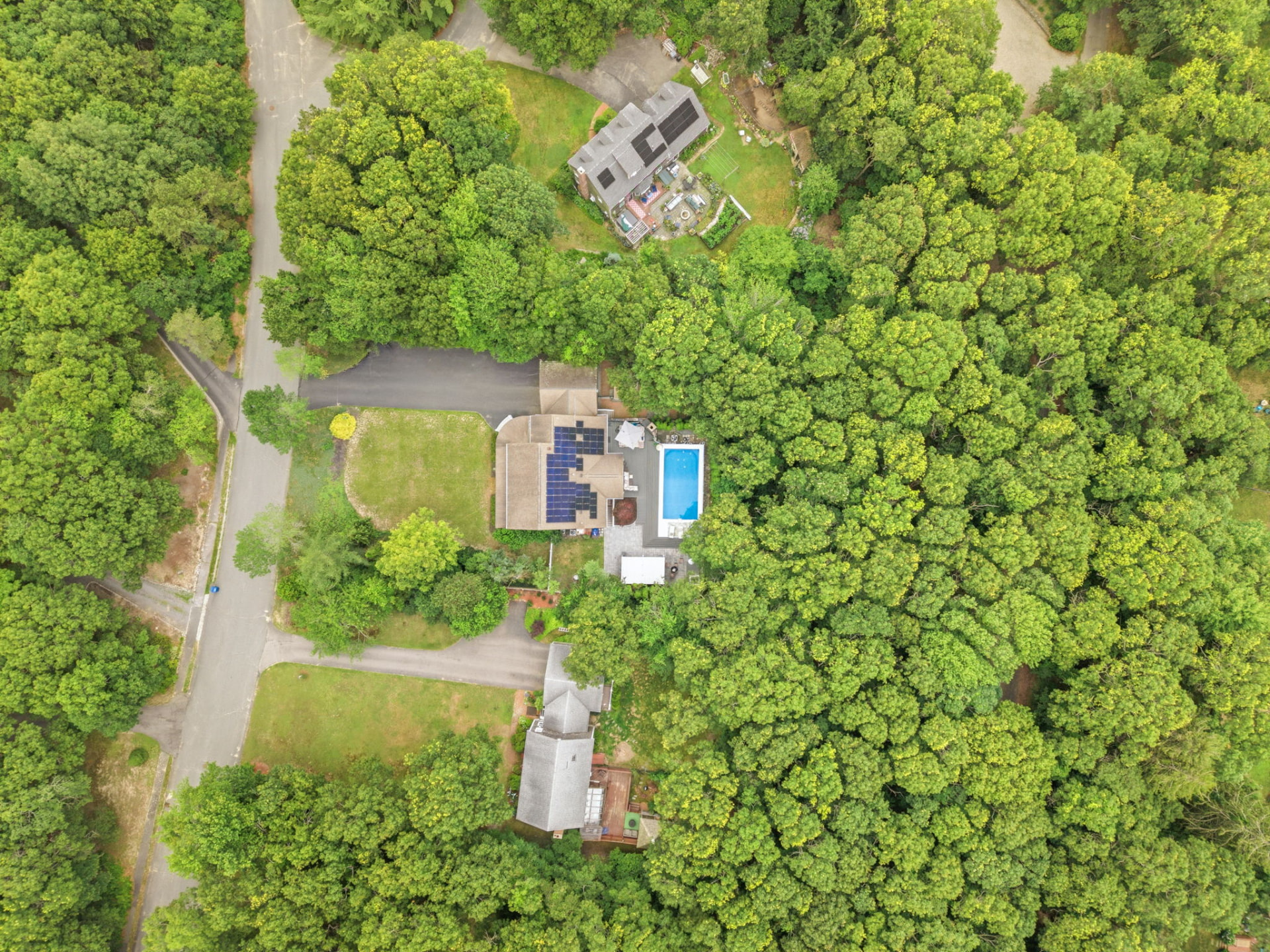 Overhead aerial of the property, deck and pool