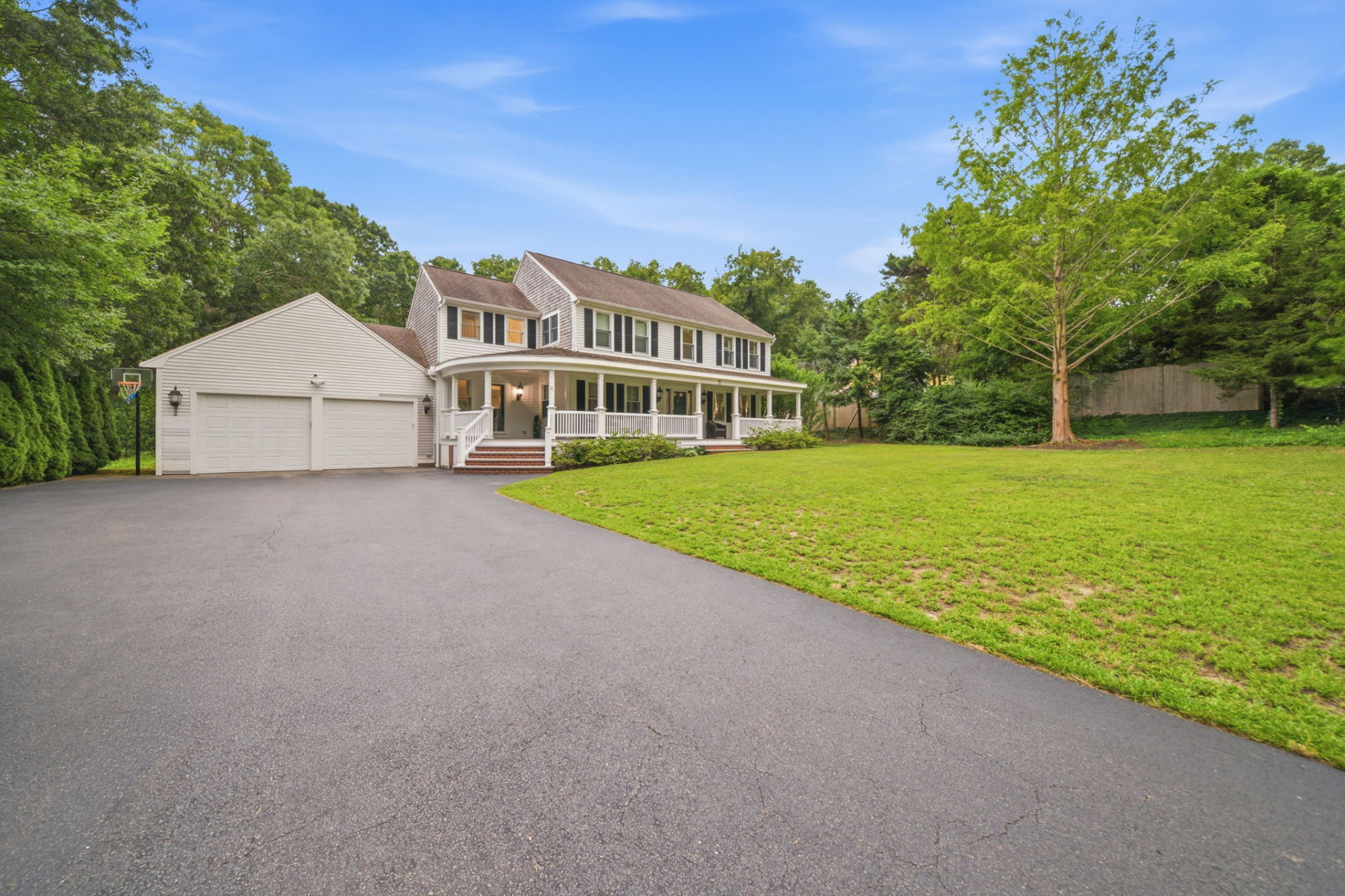 Circular driveway, two-car garage and front lawn