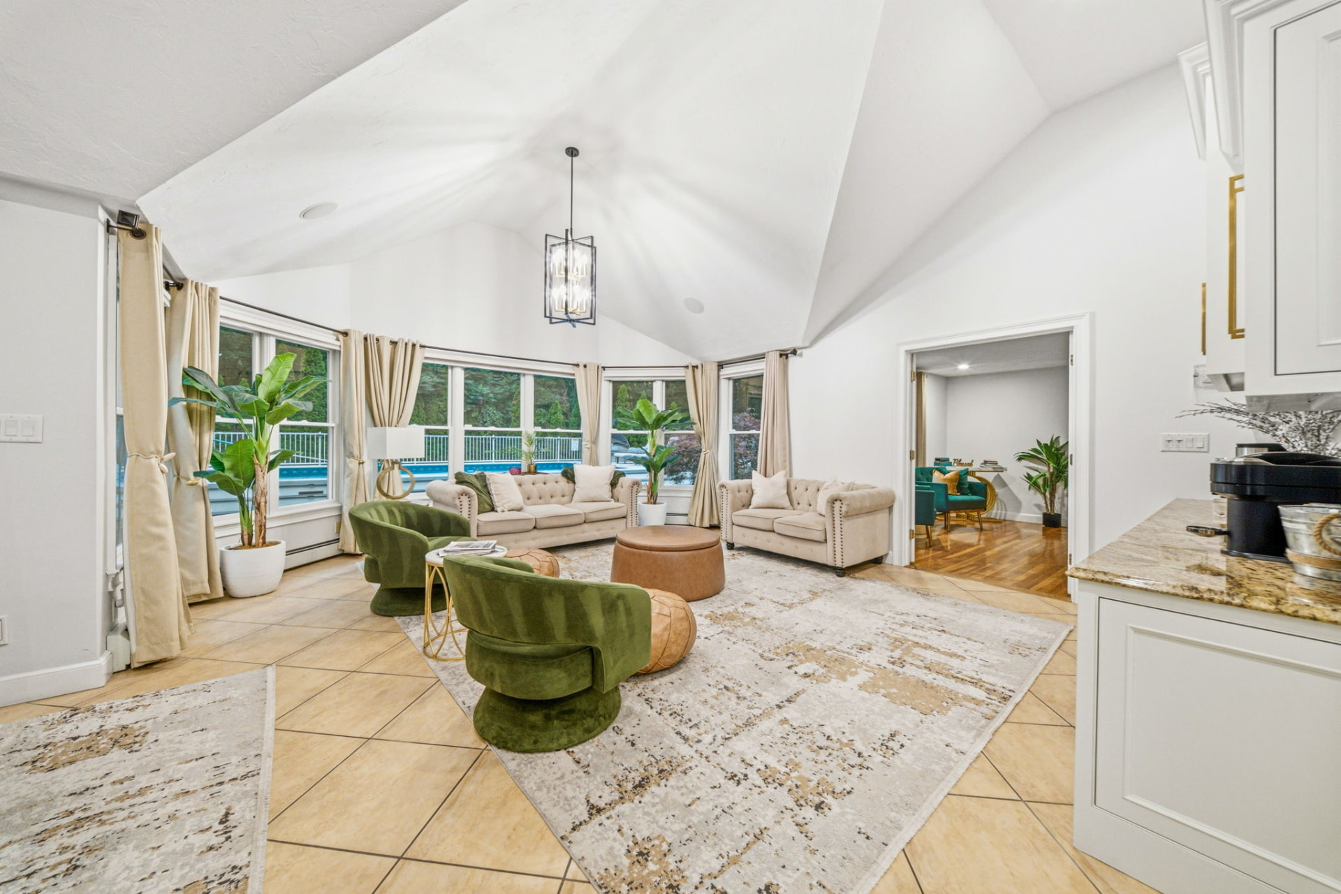 Vaulted living room overlooking the pool