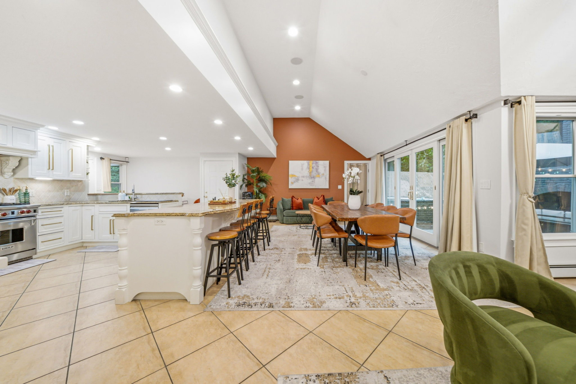 Kitchen, dining and family space with vaulted ceiling