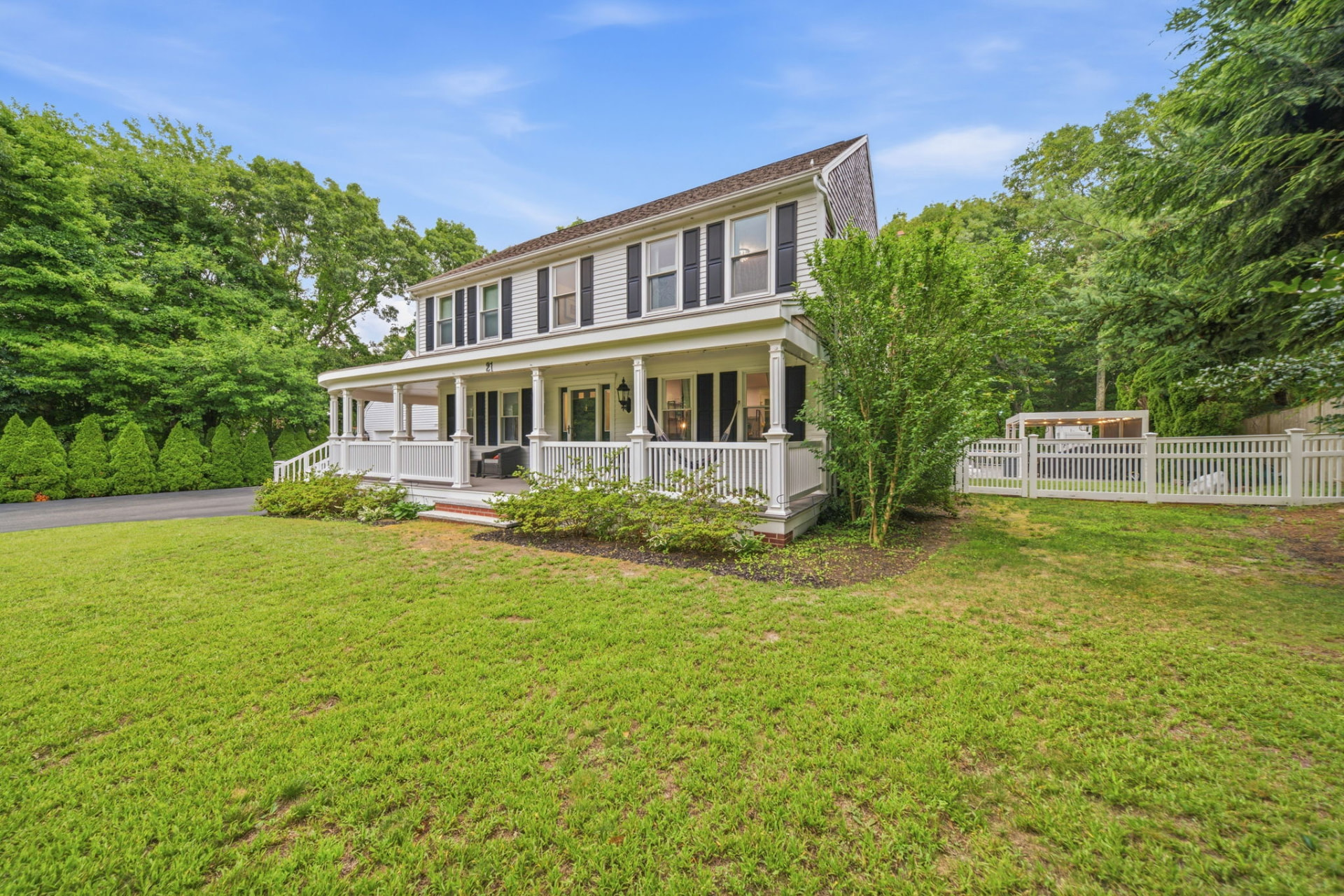 Side view of the home with wraparound farmer's porch