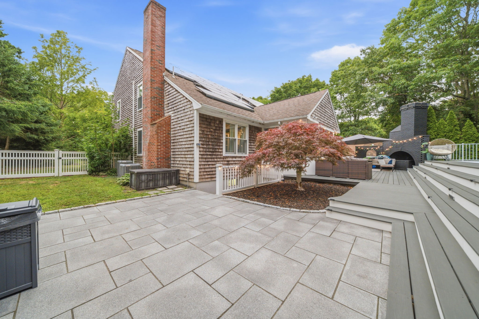Bluestone patio, Japanese maple and outdoor fireplace