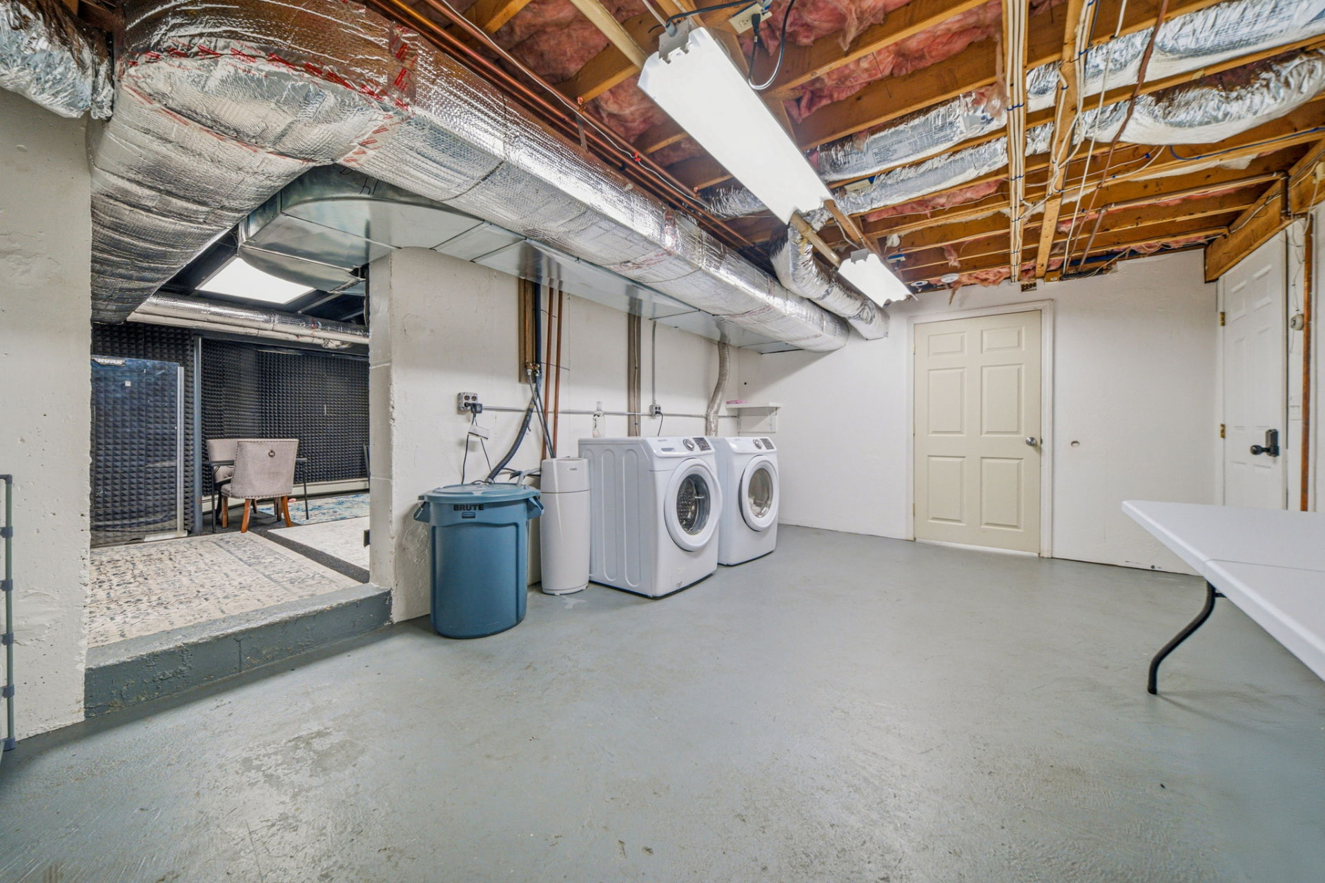 Lower level with full-size laundry and utility area