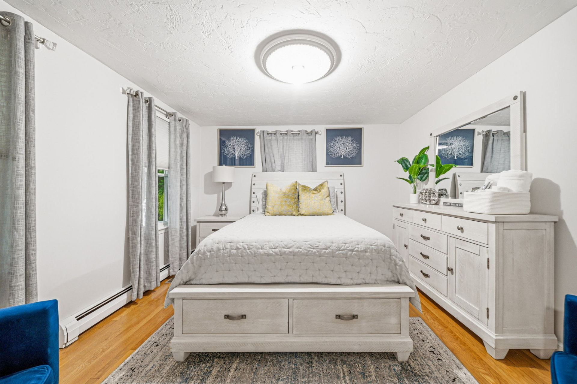 Bedroom with hardwood floors and coastal styling